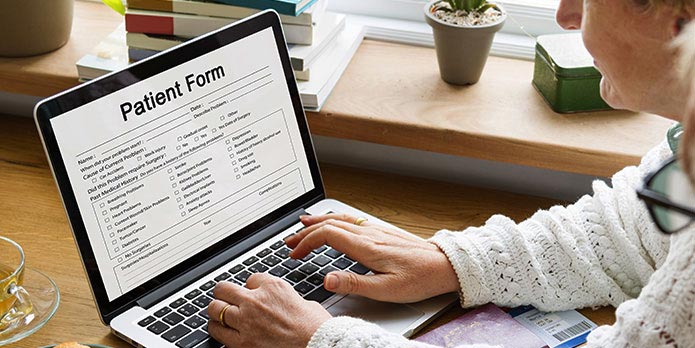 new patient of Shapero Chiropractic filling out forms online before his appointment